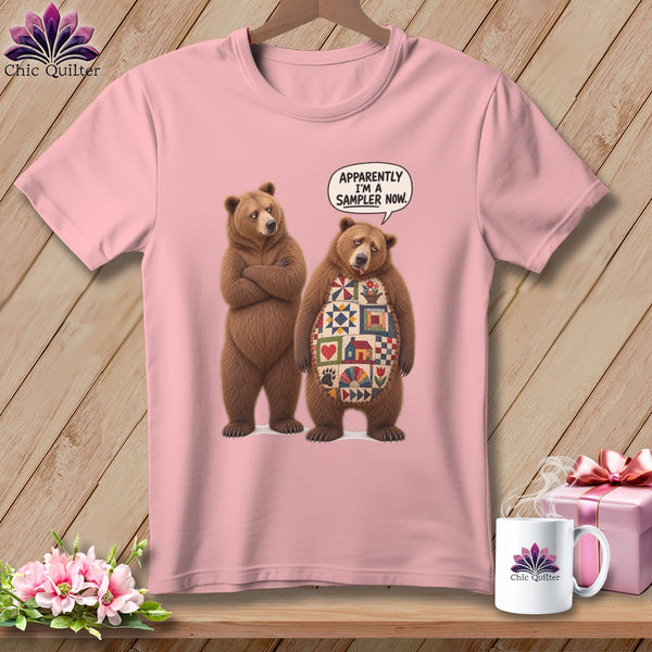 Pink t-shirt with two bears, one with a quilt pattern on its chest.