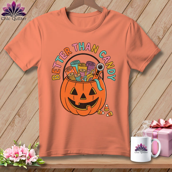 Orange t-shirt with "Better Than Candy" and pumpkin filled with sewing supplies.