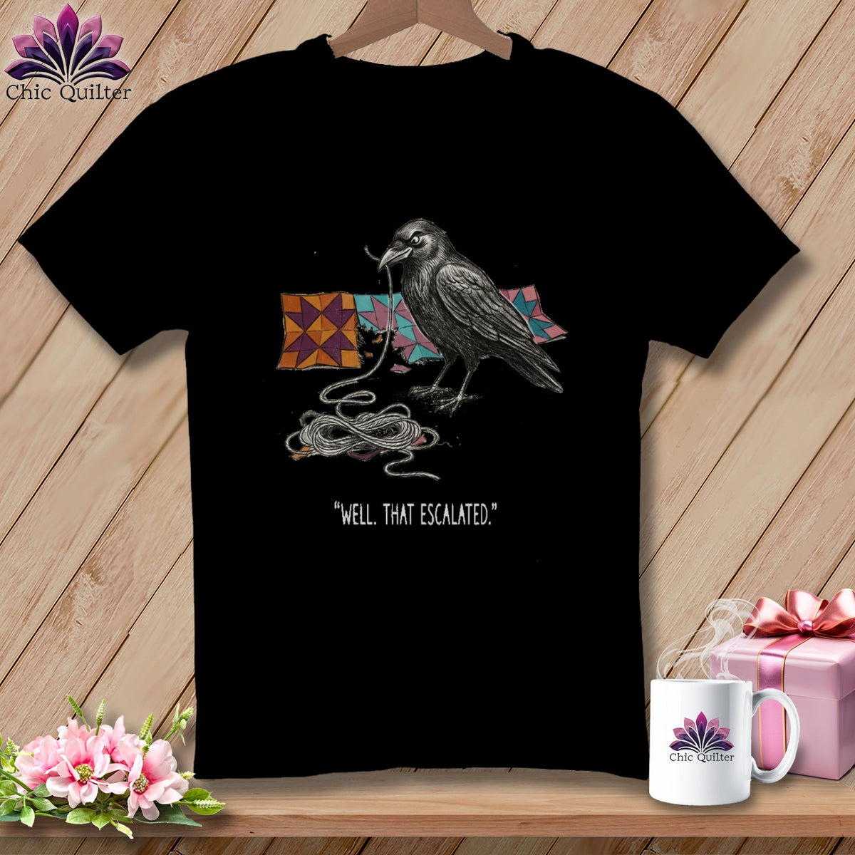 Black t-shirt with crow, quilt squares, and "Well, That Escalated" text.