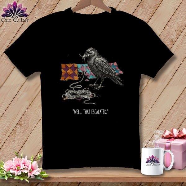 Black t-shirt with crow, quilt squares, and "Well, That Escalated" text.
