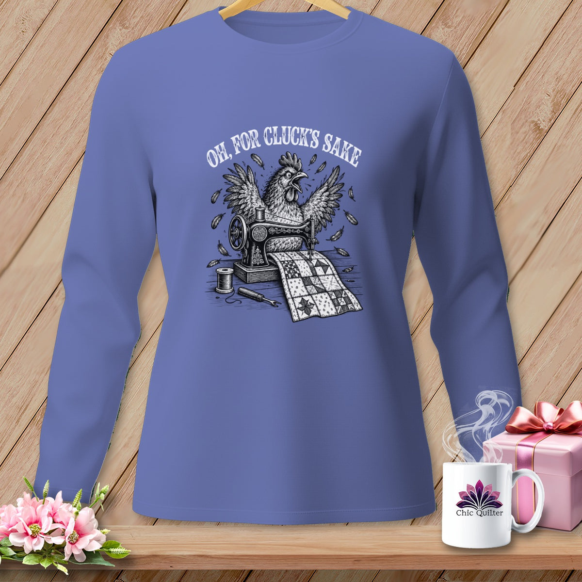 Chicken sewing a quilt with text "Oh, for Cluck's Sake" on a t-shirt.