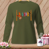 Olive green long-sleeve shirt with colorful patchwork bats hanging on a clothesline.