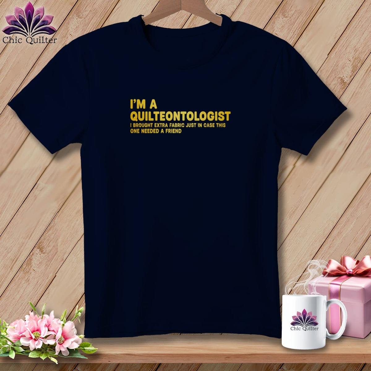 Navy t-shirt with yellow text "I'm a Quilteontologist I brought extra fabric".