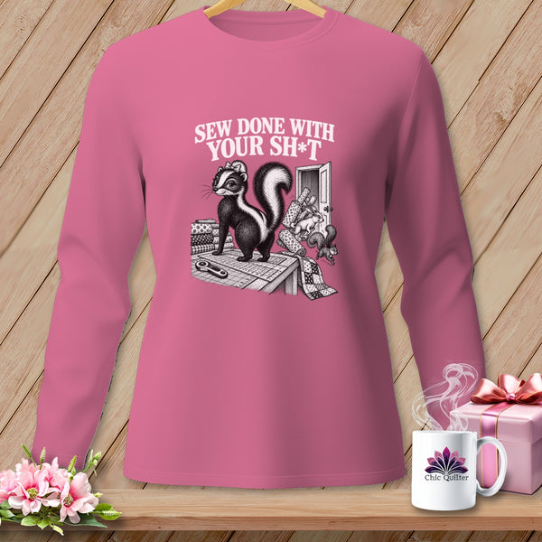Long sleeve pink shirt with skunk and sewing supplies graphic: "Sew Done With Your Sh*t"
