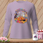 Quilters After Dark graphic on a lavender long-sleeve shirt featuring Halloween characters and pumpkins.