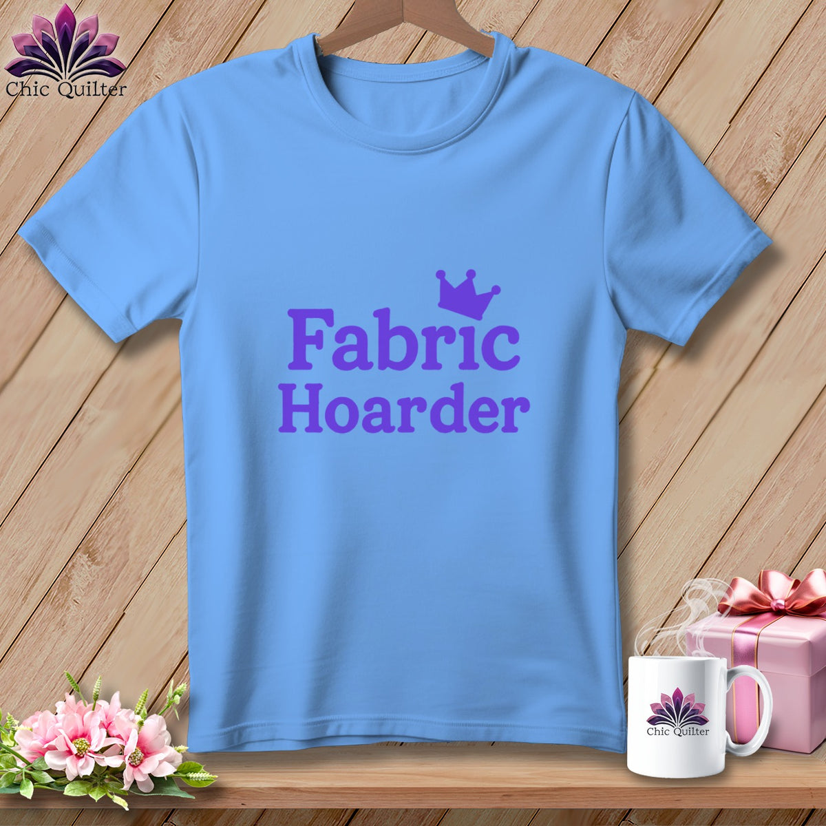 Blue t-shirt with purple text "Fabric Hoarder" and a crown.