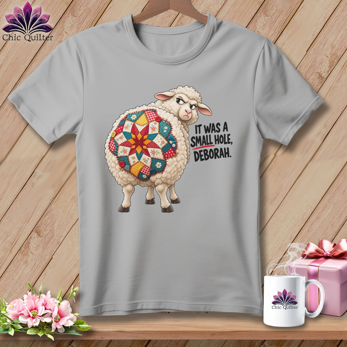 Sheep with quilt pattern on its back and text "IT WAS A SMALL HOLE, DEBORAH."