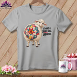 Sheep with quilt pattern on its back and text 