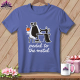 Purple t-shirt with cartoon penguin at sewing machine, holding a drink, and text 