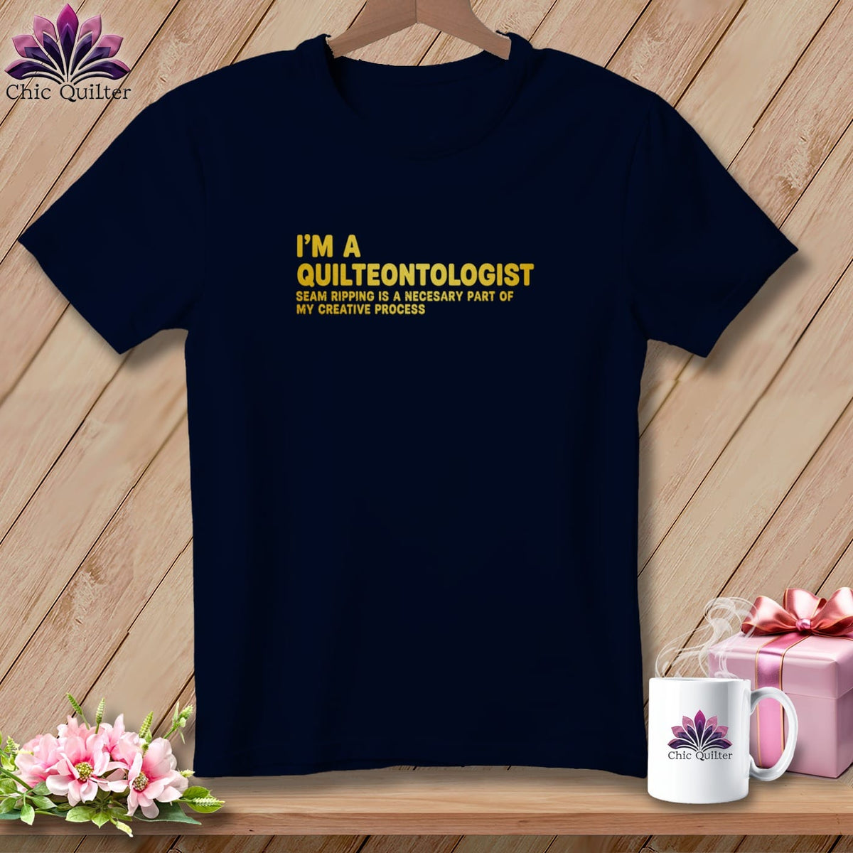 Navy t-shirt with "I'm a Quilteontologist" text and a floral logo.