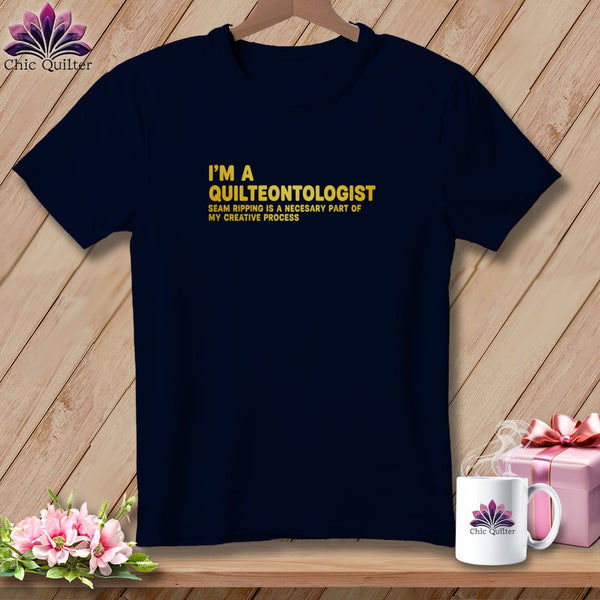 Navy t-shirt with "I'm a Quilteontologist" text and a floral logo.
