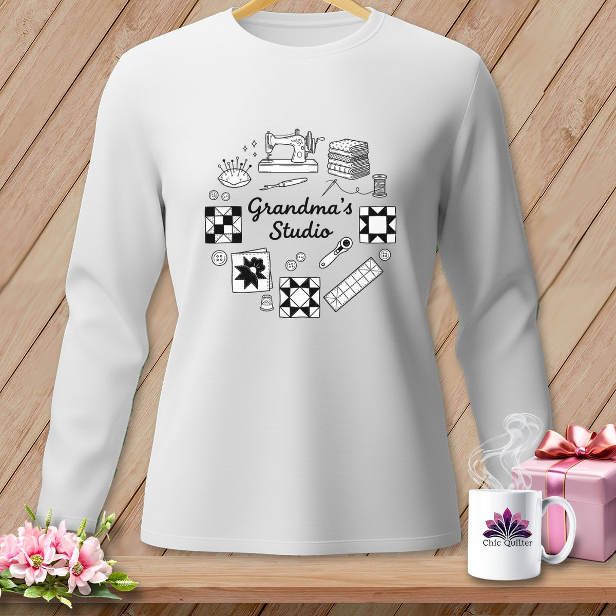White long-sleeve shirt with sewing-themed graphics and "Grandma's Studio" text.