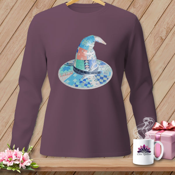 Long sleeve plum t-shirt featuring a patchwork witch hat graphic with scissors and tape measure.