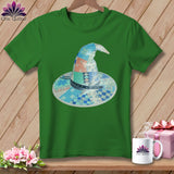 Green t-shirt with a patchwork witch hat featuring scissors and measuring tape.