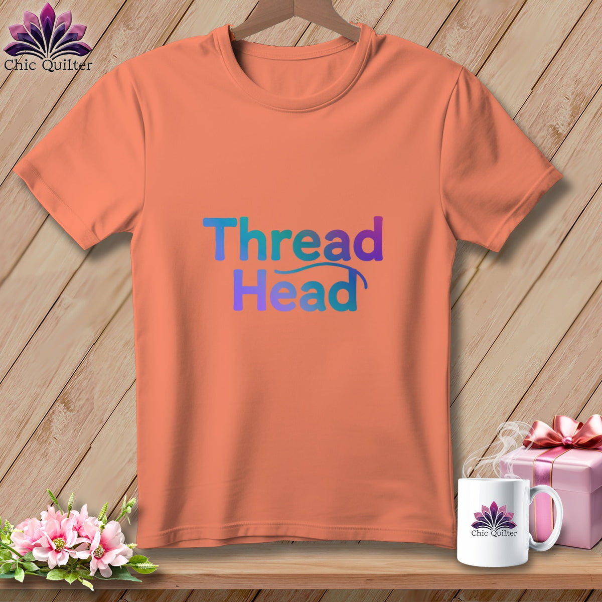 Peach t-shirt with "Thread Head" text in gradient blue and purple colors.