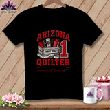 Black t-shirt featuring a quilting graphic with a crate of fabric, the number one, and red text reading Arizona Quilter.