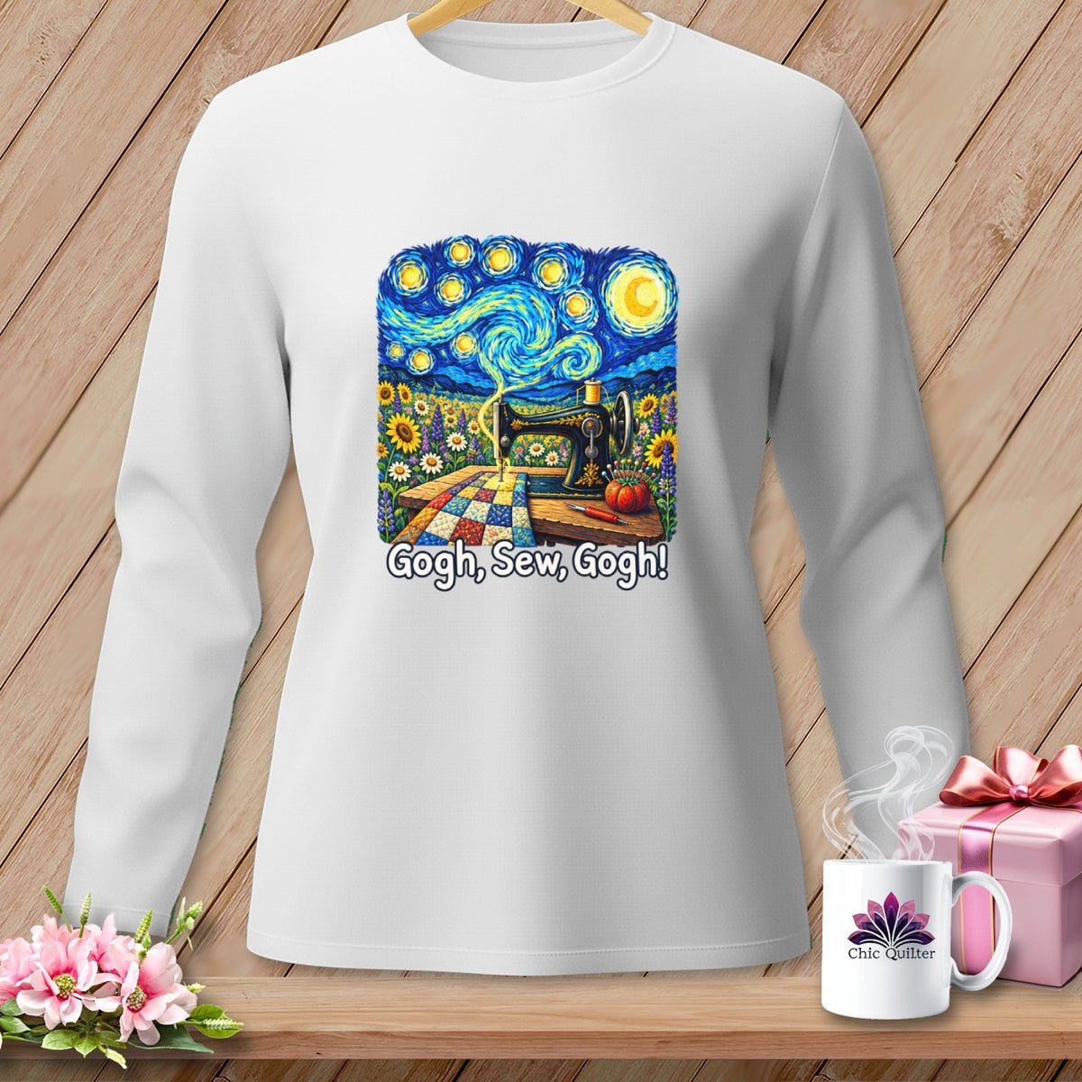 White long-sleeve shirt with a "Starry Night" inspired graphic of a sewing machine, flowers, and quilt.