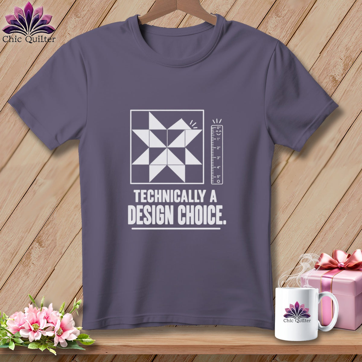 Gray t-shirt with quilt block graphic and text "TECHNICALLY A DESIGN CHOICE."