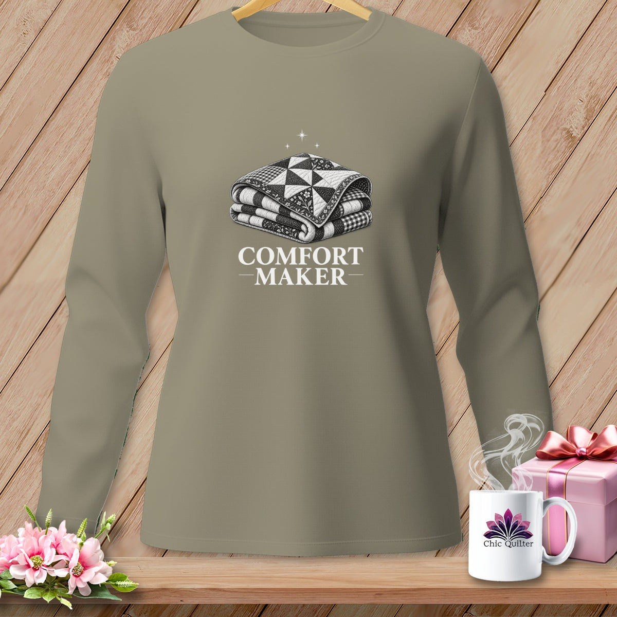 Long-sleeved shirt with a folded quilt graphic and "COMFORT MAKER" text.
