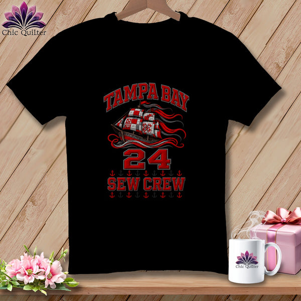 A black t-shirt featuring a red pirate ship graphic with Tampa Bay 24 Sew Crew text.