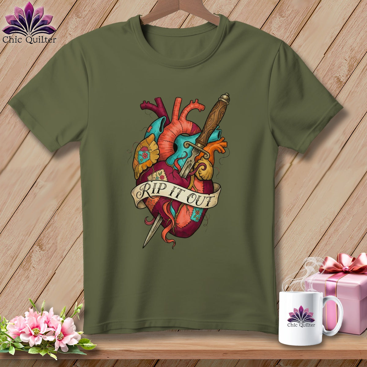 Olive green t-shirt with a stylized anatomical heart graphic with "Rip It Out" banner.