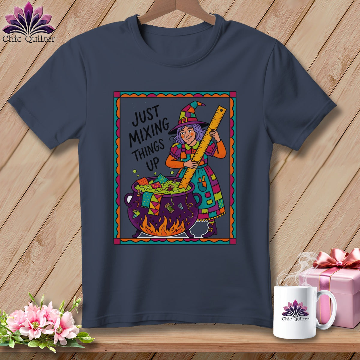 T-shirt with witch stirring a cauldron, text "Just Mixing Things Up".