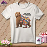 White t-shirt with a bear wearing a patchwork blanket, reading 