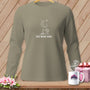 Tan long-sleeve shirt with a sewing machine, moon, stars, and text "ONE MORE ROW".