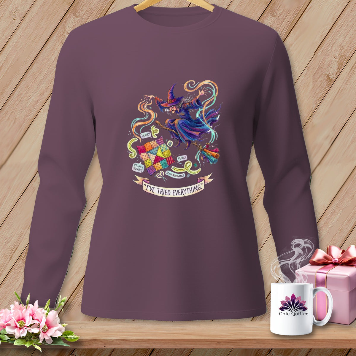Long-sleeve purple shirt with a witch sewing a quilt, text reads "I've tried everything."