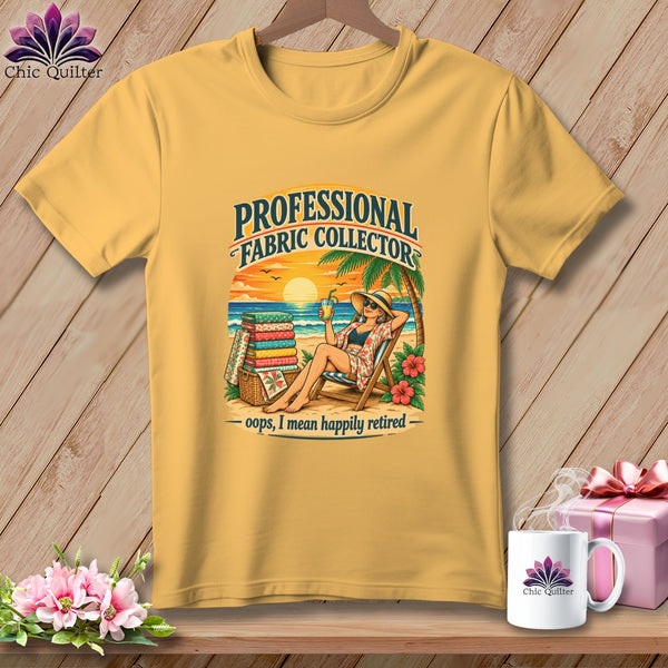 A mustard yellow t-shirt with a beach graphic reading Professional Fabric Collector, Oops, I mean happily retired.
