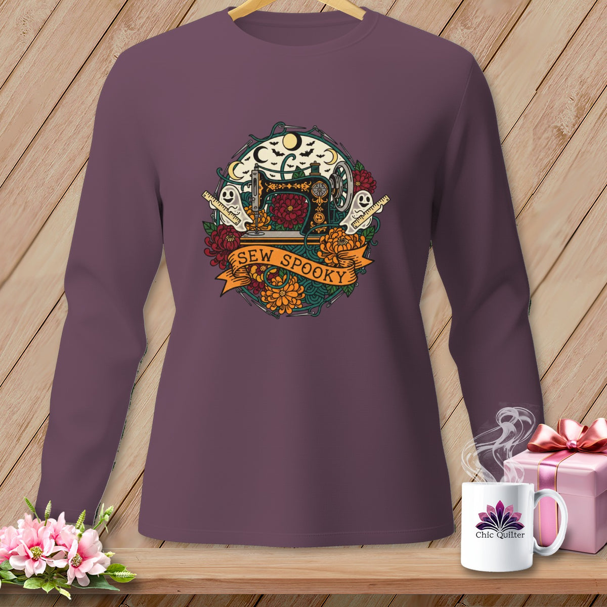Long sleeve shirt with a "Sew Spooky" Halloween graphic featuring a sewing machine and ghosts.