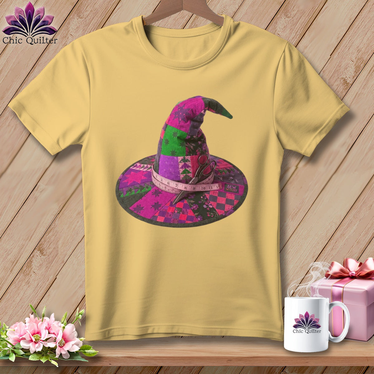 Yellow t-shirt with a patchwork witch hat design, scissors, and measuring tape.