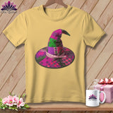 Yellow t-shirt with a patchwork witch hat design, scissors, and measuring tape.