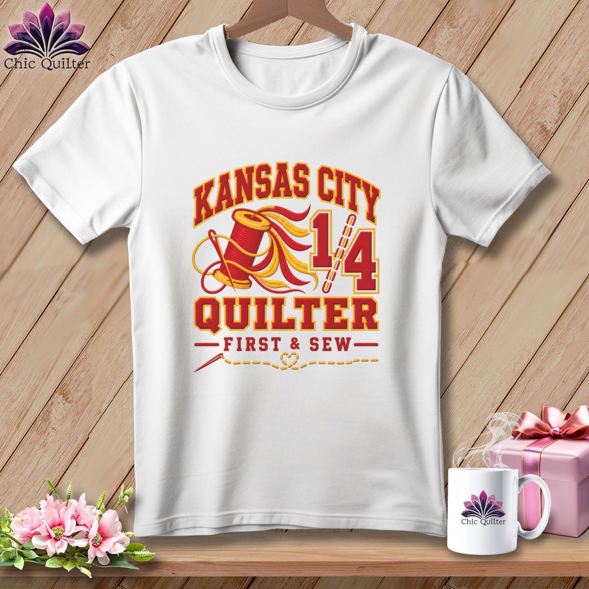 A white t-shirt features a red and yellow graphic with Kansas City Quilter text, a spool, and a needle.