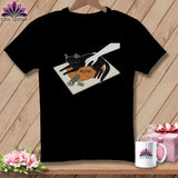 Black t-shirt with graphic of black cat on pumpkin and the word 