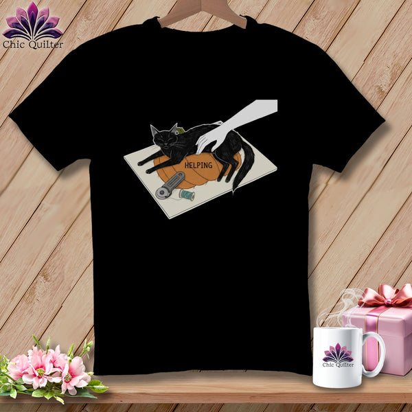 Black t-shirt with graphic of black cat on pumpkin and the word "HELPING".