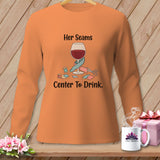 Orange long-sleeve shirt with wine glass, sewing supplies, and text 