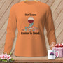 Orange long-sleeve shirt with wine glass, sewing supplies, and text "Her Seams Center To Drink."