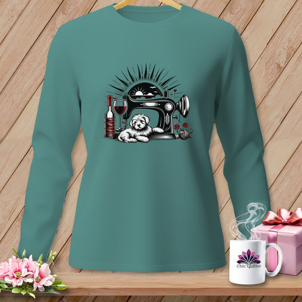 Teal long sleeve shirt with a sewing machine, dog, wine, and yarn graphic.