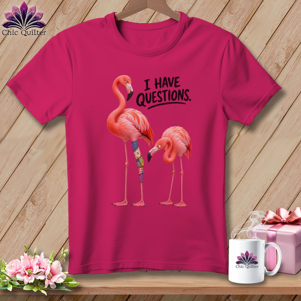 Pink t-shirt with two flamingos and text "I HAVE QUESTIONS."