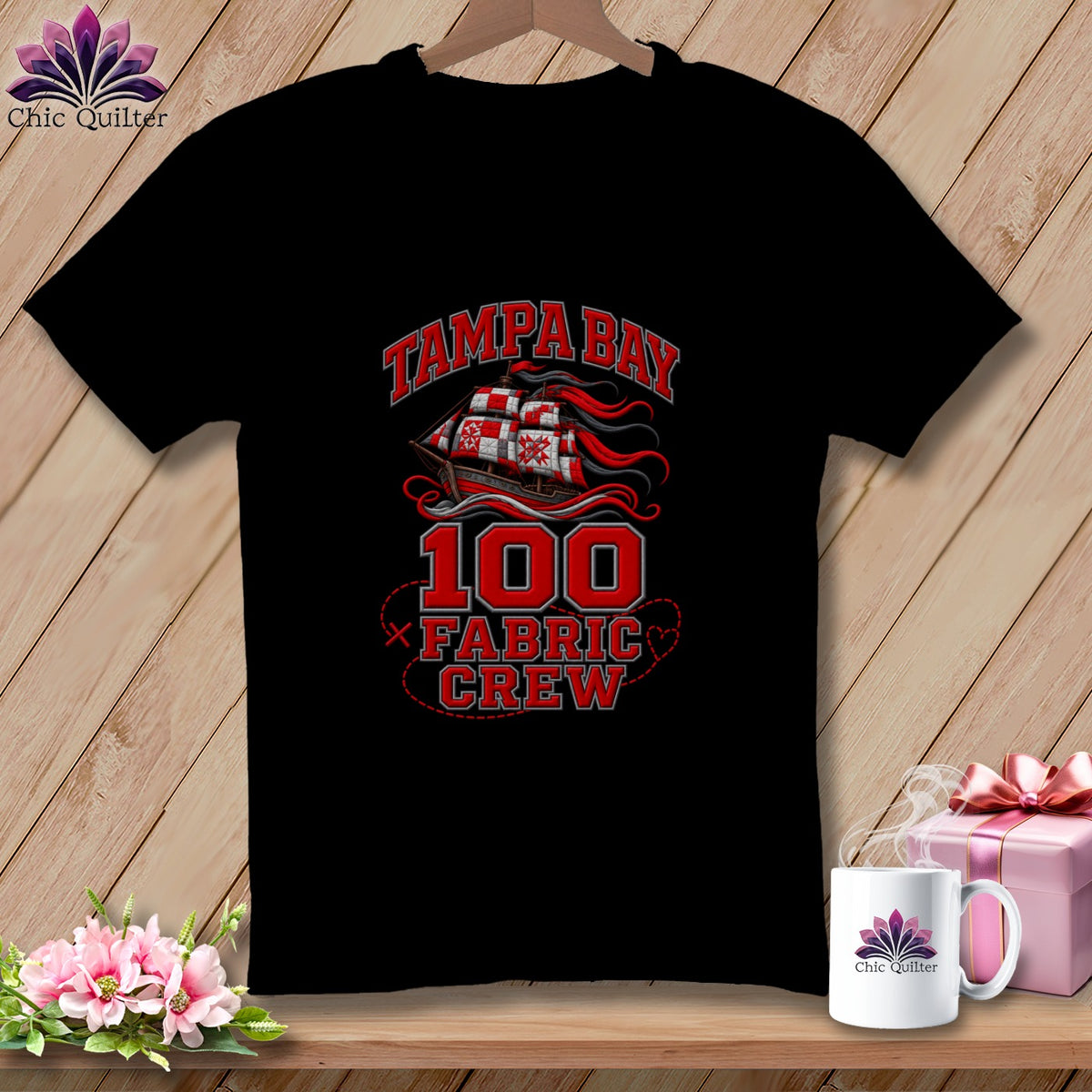 Black crewneck t-shirt featuring a red Tampa Bay pirate ship and the text 100 Fabric Crew.
