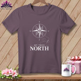 Purple t-shirt with a compass graphic and the text 