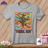 Graphic tee with a witch flying on a ruler with bats and the text 
