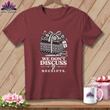 Burgundy t-shirt with stack of fabric, scissors, and text 