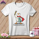 White t-shirt featuring a cartoon duck in a red cape holding a rotary cutter with text We Cut At Dawn.