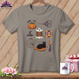Grey t-shirt with Halloween sewing icons: pumpkin, ghost, cat, and more.