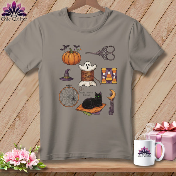 Grey t-shirt with Halloween sewing icons: pumpkin, ghost, cat, and more.