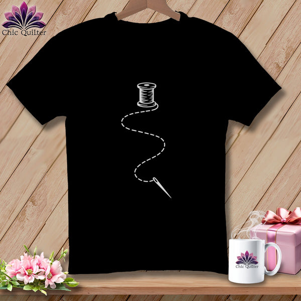 Black t-shirt with white embroidery design of thread, needle, and spool of thread.