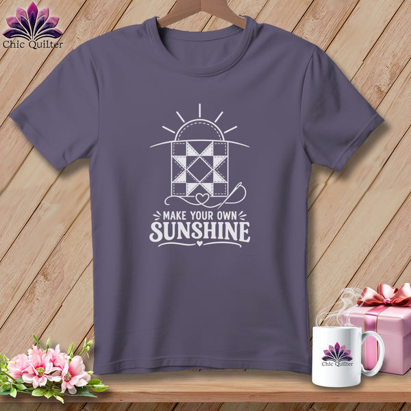 Purple t-shirt with white quilt block graphic and "Make Your Own Sunshine" text.