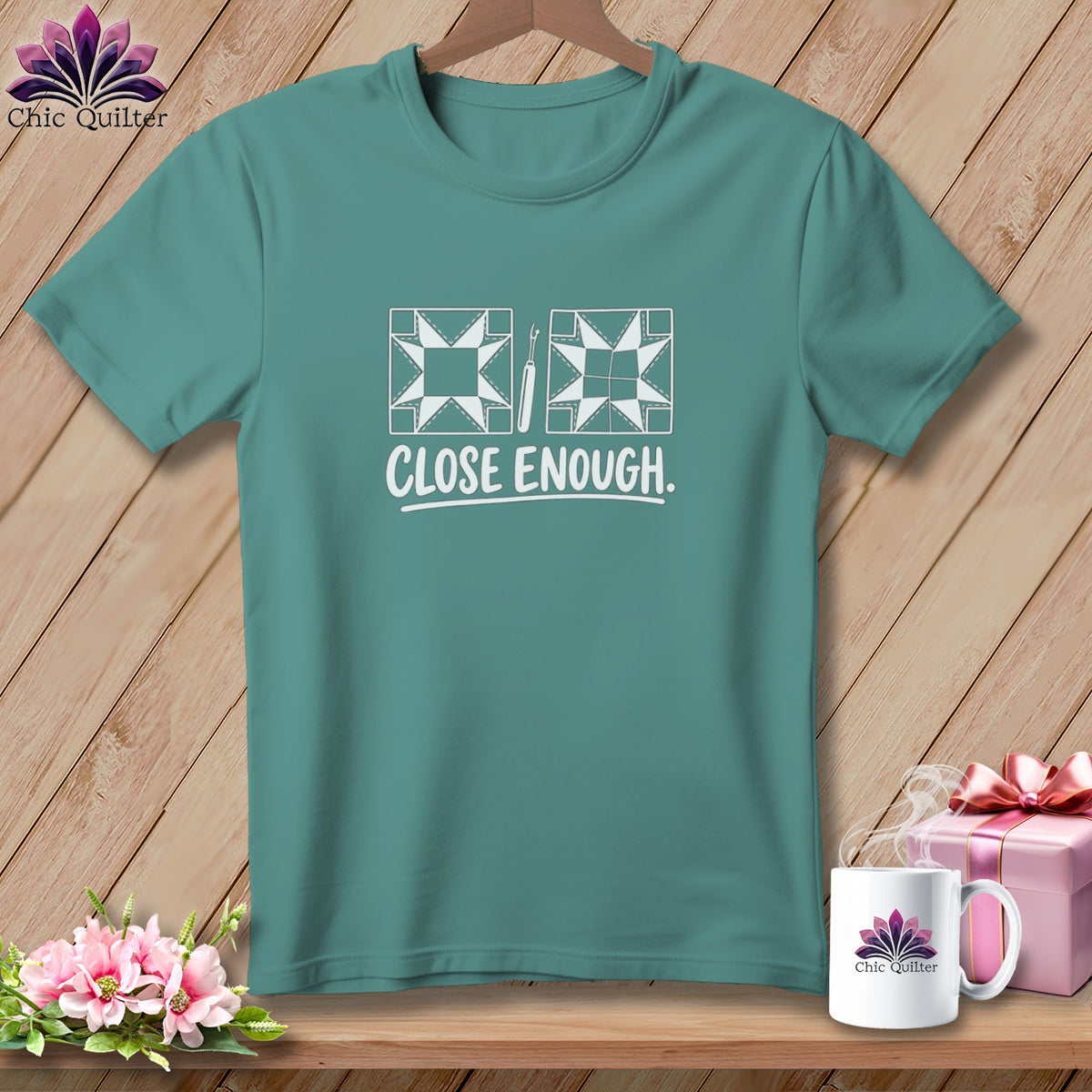 Teal t-shirt with "CLOSE ENOUGH" and quilting block graphics.
